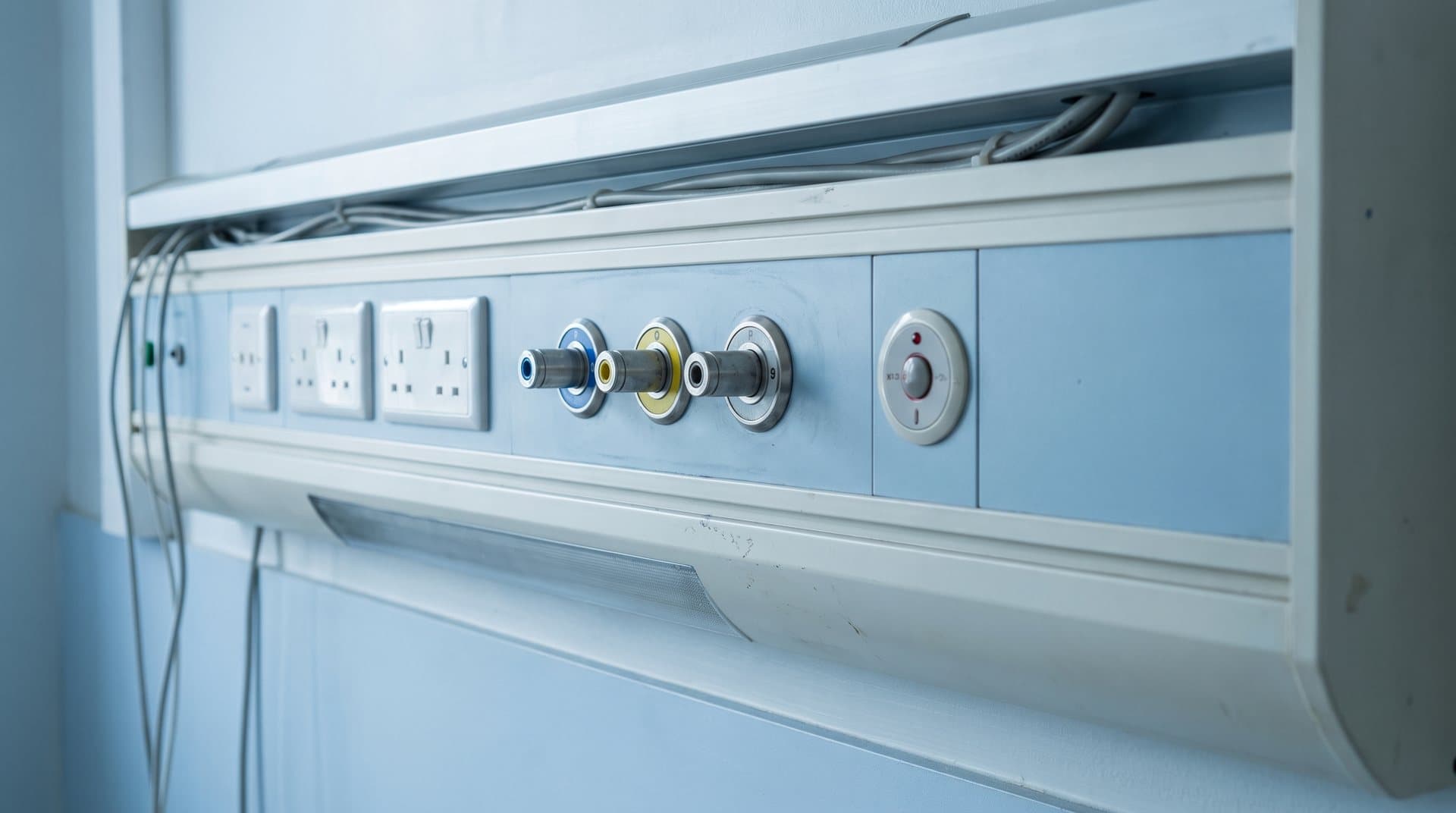 Hospital bedhead services panel with gas and power outlets